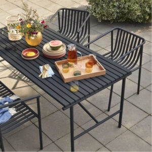Black metal square modern chair for indoor or outdoor use on a terrace.