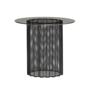 Round black table made of metal and transparent glass cylinder