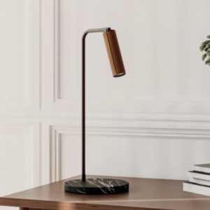 he desk/table lamp is black with brown metal and leather.